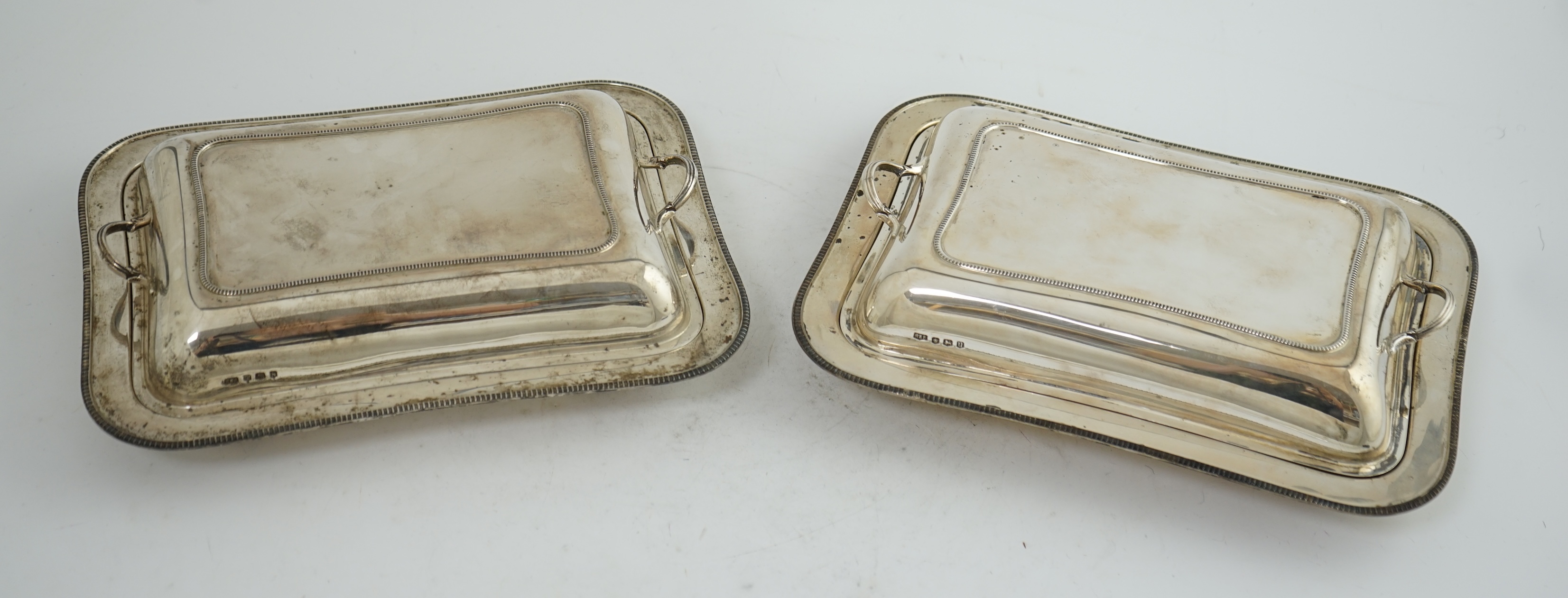 A pair of 1930's silver entrée dishes and covers, by Roberts & Belk